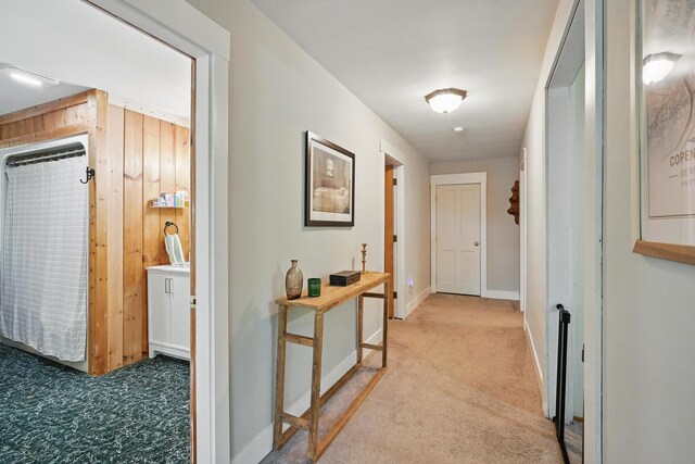 14 Greenleaf Ln, Monmouth, ME 04259 - hallway with light carpet, wood walls, and baseboards