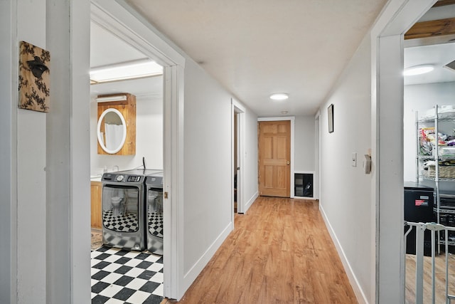 14 Greenleaf Ln, Monmouth, ME 04259 - hall with separate washer and dryer, light floors, and baseboards