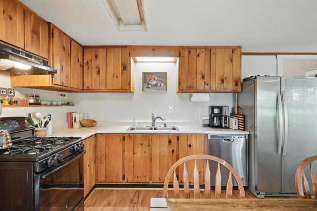14 Greenleaf Ln, Monmouth, ME 04259 - kitchen featuring stainless steel appliances, extractor fan, a sink, light wood finished floors, and light countertops