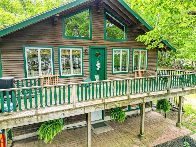 14 Greenleaf Ln, Monmouth, ME 04259 - rear view of house with a deck and a patio
