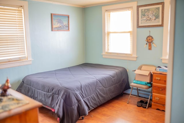 50 Green St, Biddeford, ME 04005 - bedroom featuring baseboard heating, ornamental molding, and wood finished floors