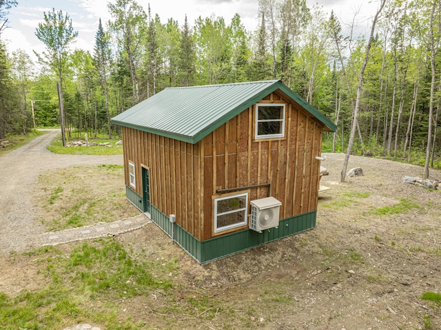 105 Gales Rd, Abbot, ME 04406 - view of outdoor structure with a cooling unit and a wooded view