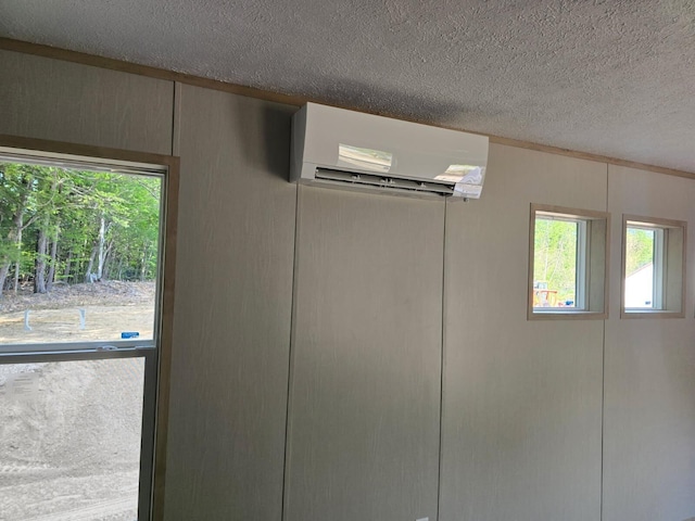 440 High St, Sanford, ME 04073 - detailed view of a wall mounted AC and a textured ceiling