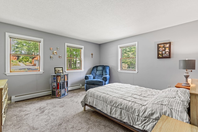 23 E Eleanor Ave, Standish, ME 04084 - bedroom with multiple windows, carpet floors, a baseboard radiator, and a textured ceiling