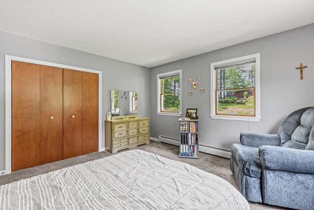 23 E Eleanor Ave, Standish, ME 04084 - carpeted bedroom with baseboard heating and a closet
