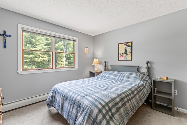 23 E Eleanor Ave, Standish, ME 04084 - carpeted bedroom with a baseboard heating unit and a textured ceiling