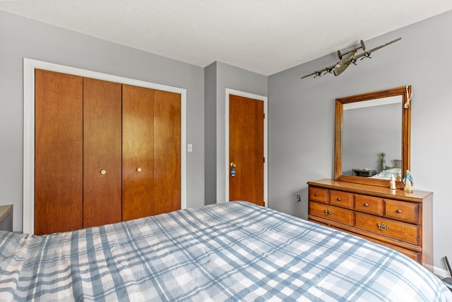 23 E Eleanor Ave, Standish, ME 04084 - bedroom with a closet and a textured ceiling