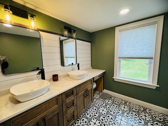 228 Mcburnie Rd, Presque Isle, ME 04769 - full bathroom with double vanity, tile patterned flooring, and recessed lighting