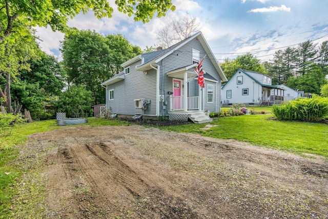 194 Larkin St, Bangor, ME 04401 - view of front of home featuring a front lawn and a chimney