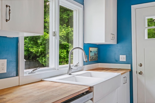 194 Larkin St, Bangor, ME 04401 - kitchen featuring wood counters, white cabinets, and a sink