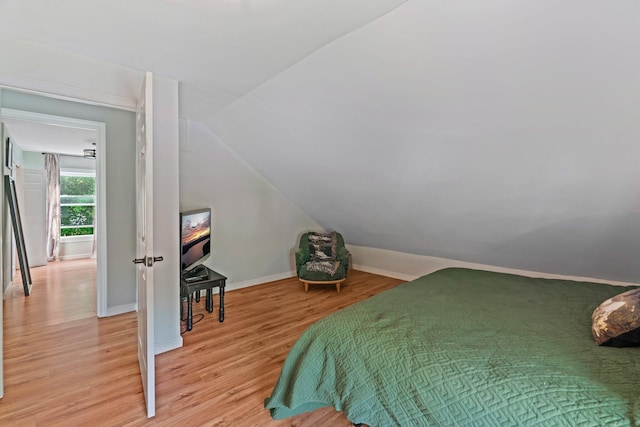 194 Larkin St, Bangor, ME 04401 - bedroom with light wood finished floors, vaulted ceiling, and baseboards