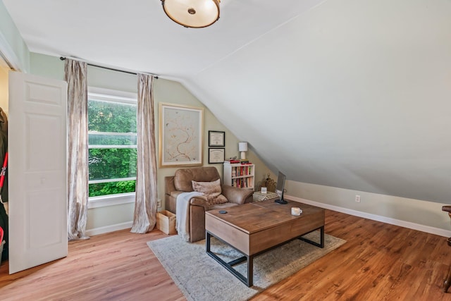 194 Larkin St, Bangor, ME 04401 - living area with lofted ceiling, light wood-style floors, and baseboards