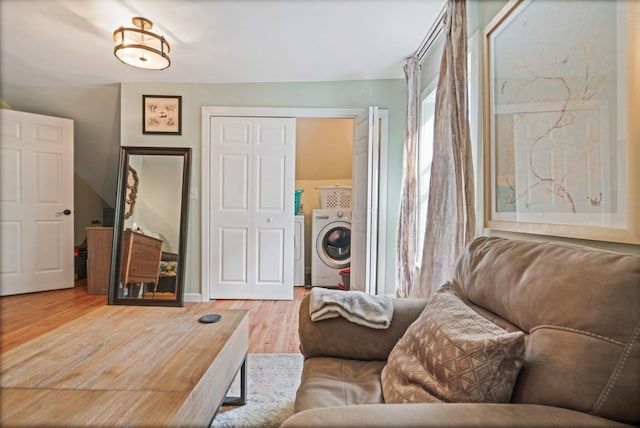194 Larkin St, Bangor, ME 04401 - living area featuring wood finished floors and separate washer and dryer