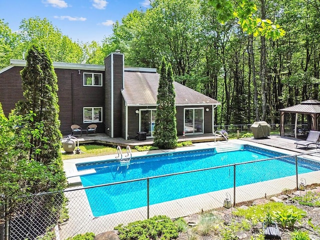 363 Winthrop Center Rd, Winthrop, ME 04364 - outdoor pool with a gazebo, a diving board, a deck, and grilling area