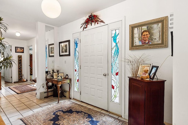 363 Winthrop Center Rd, Winthrop, ME 04364 - foyer entrance with light tile patterned floors and baseboard heating