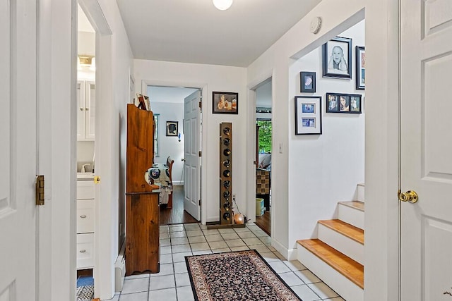 363 Winthrop Center Rd, Winthrop, ME 04364 - hallway featuring light tile patterned floors, stairs, and baseboards