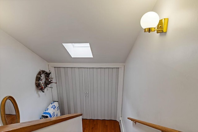 363 Winthrop Center Rd, Winthrop, ME 04364 - hallway with a skylight, wood finished floors, and baseboard heating