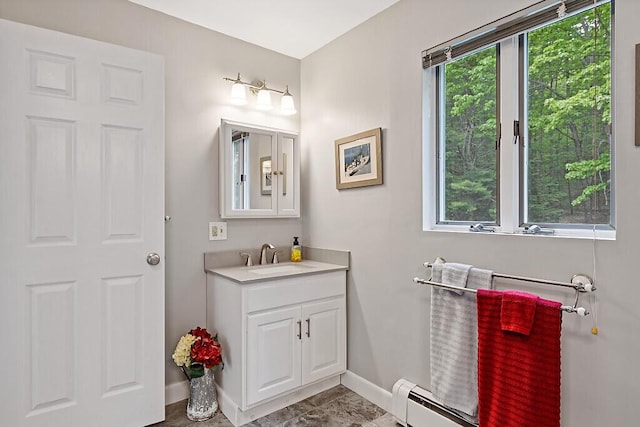 363 Winthrop Center Rd, Winthrop, ME 04364 - bathroom with a baseboard heating unit, vanity, and baseboards