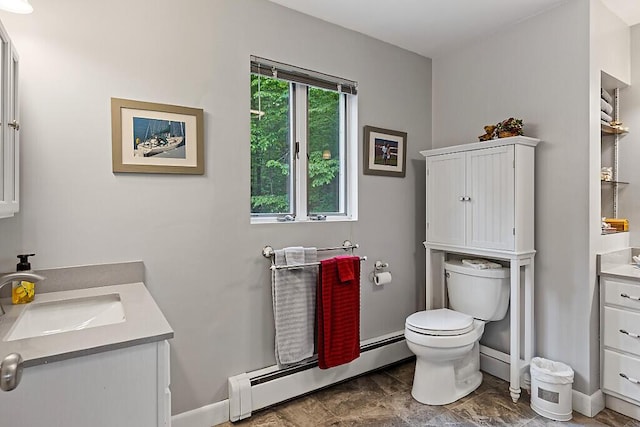 363 Winthrop Center Rd, Winthrop, ME 04364 - bathroom with a baseboard radiator, vanity, toilet, and baseboards