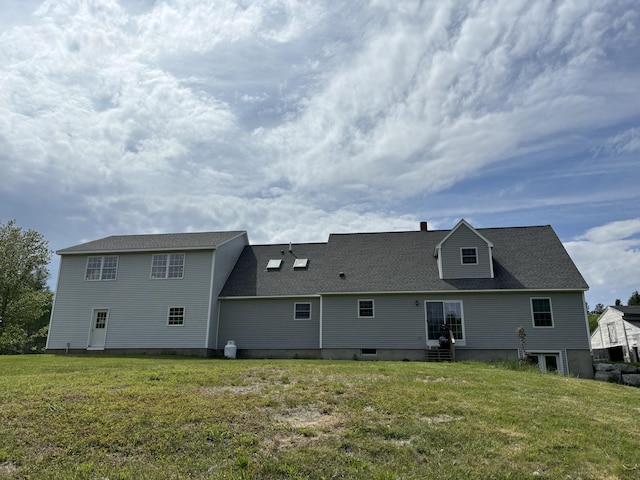 25 Raccoon Rd, Cushing, ME 04563 - rear view of property with entry steps and a yard