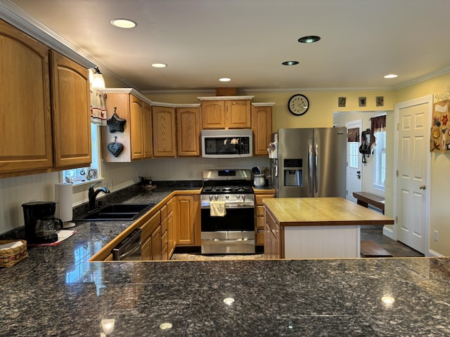 25 Raccoon Rd, Cushing, ME 04563 - kitchen with stainless steel appliances, plenty of natural light, crown molding, butcher block countertops, and recessed lighting
