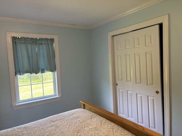 25 Raccoon Rd, Cushing, ME 04563 - bedroom with ornamental molding and a closet