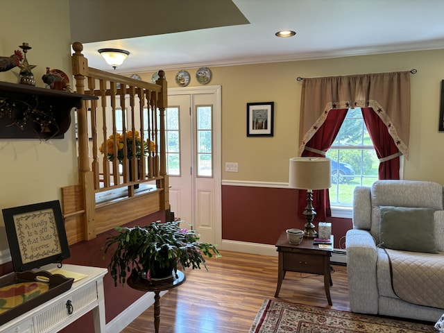 25 Raccoon Rd, Cushing, ME 04563 - living room with wood finished floors, ornamental molding, recessed lighting, and a baseboard heating unit