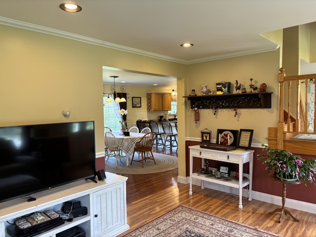 25 Raccoon Rd, Cushing, ME 04563 - living area with wood finished floors, crown molding, and recessed lighting