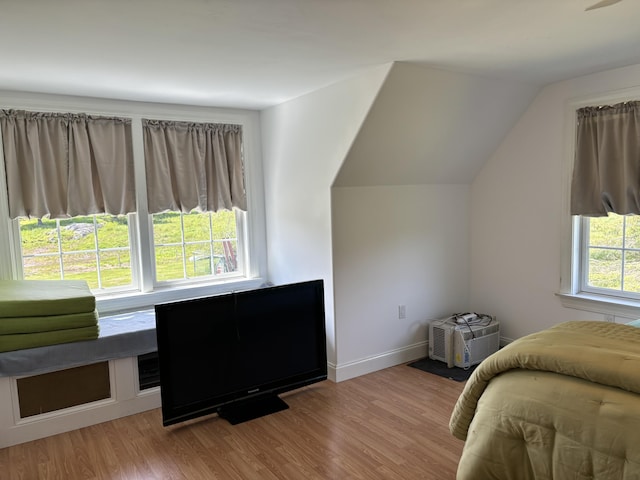 25 Raccoon Rd, Cushing, ME 04563 - bedroom featuring wood finished floors and vaulted ceiling