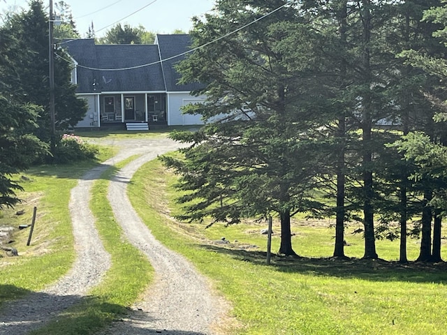 25 Raccoon Rd, Cushing, ME 04563 - view of front of home with driveway and a front yard