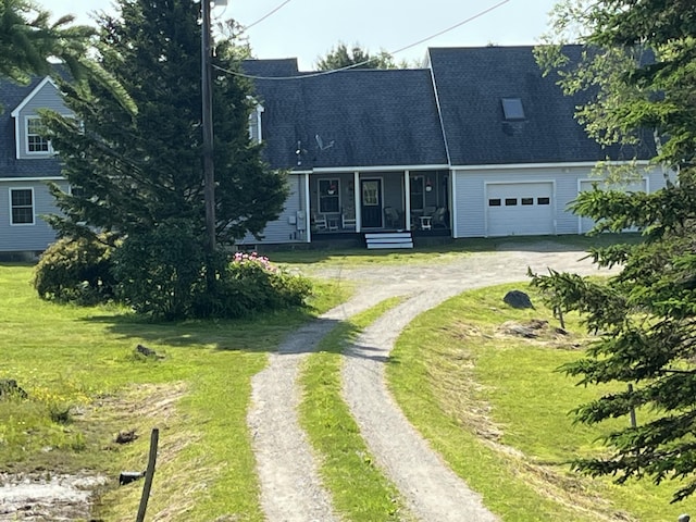 25 Raccoon Rd, Cushing, ME 04563 - cape cod house with driveway, a garage, and a shingled roof