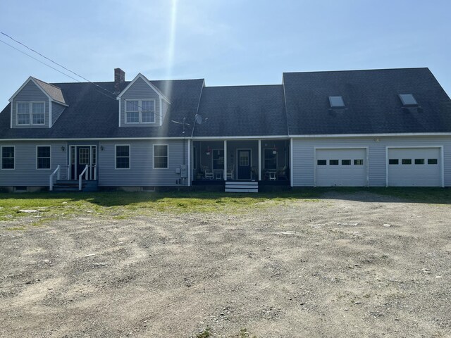 25 Raccoon Rd, Cushing, ME 04563 - view of front of property featuring a chimney, dirt driveway, roof with shingles, and an attached garage