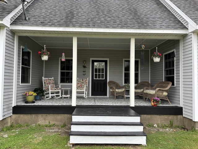 25 Raccoon Rd, Cushing, ME 04563 - property entrance with a shingled roof and a porch