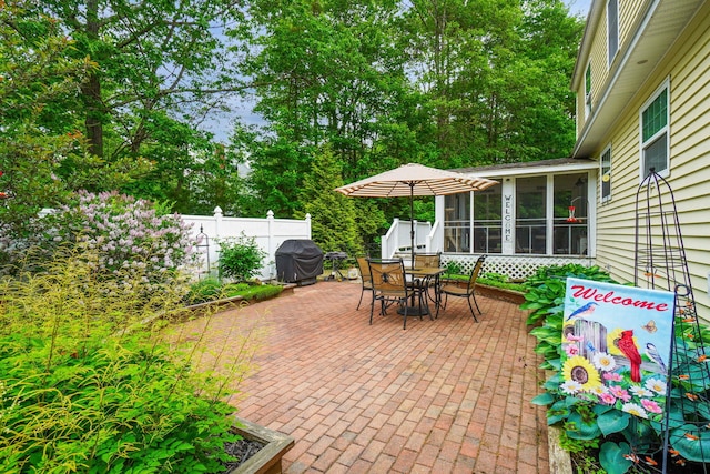 176 Weeks Rd, Gorham, ME 04038 - view of patio with a sunroom, outdoor dining area, and area for grilling