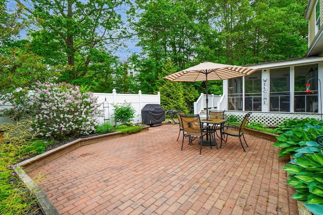 176 Weeks Rd, Gorham, ME 04038 - view of patio featuring outdoor dining area, a sunroom, a grill, and view of scattered trees