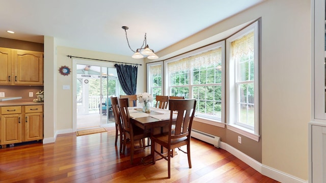 176 Weeks Rd, Gorham, ME 04038 - dining area featuring light wood-style floors, a baseboard heating unit, baseboards, and recessed lighting