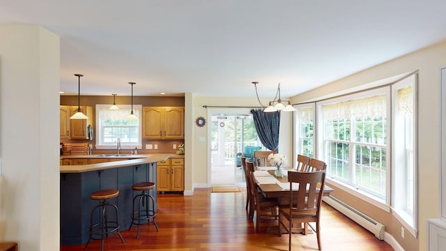 176 Weeks Rd, Gorham, ME 04038 - dining space with a baseboard heating unit, light wood finished floors, a chandelier, baseboards, and recessed lighting