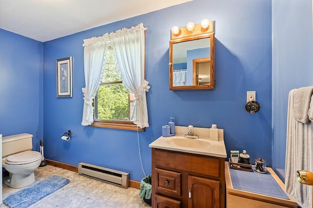 125 Lone Indian Trl, Augusta, ME 04330 - bathroom with a baseboard radiator, vanity, toilet, baseboards, and tile patterned floors