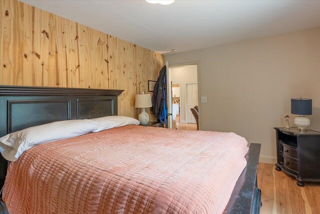 144 Woody Ln, Cushing, ME 04563 - bedroom featuring light wood-style flooring and wooden walls