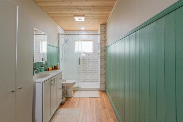 144 Woody Ln, Cushing, ME 04563 - full bathroom with toilet, vanity, a stall shower, wood finished floors, and wooden ceiling