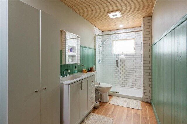 144 Woody Ln, Cushing, ME 04563 - full bath with toilet, a shower stall, vanity, wooden ceiling, and wood finished floors
