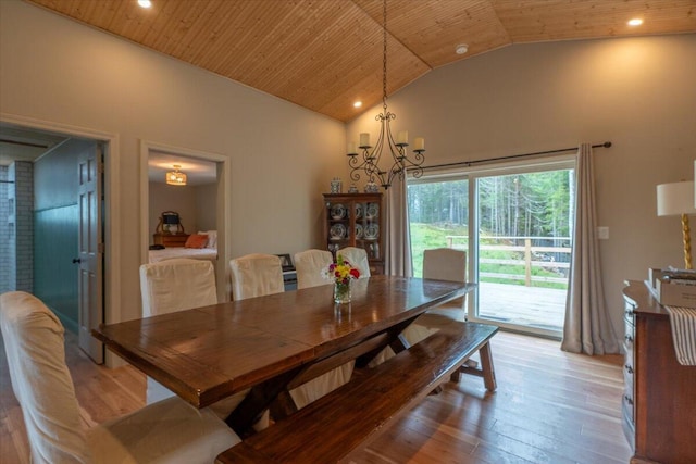 144 Woody Ln, Cushing, ME 04563 - dining space featuring light wood-style flooring, vaulted ceiling, wood ceiling, a chandelier, and recessed lighting