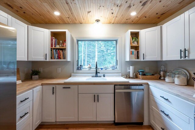 144 Woody Ln, Cushing, ME 04563 - kitchen with appliances with stainless steel finishes, open shelves, a sink, recessed lighting, and light countertops