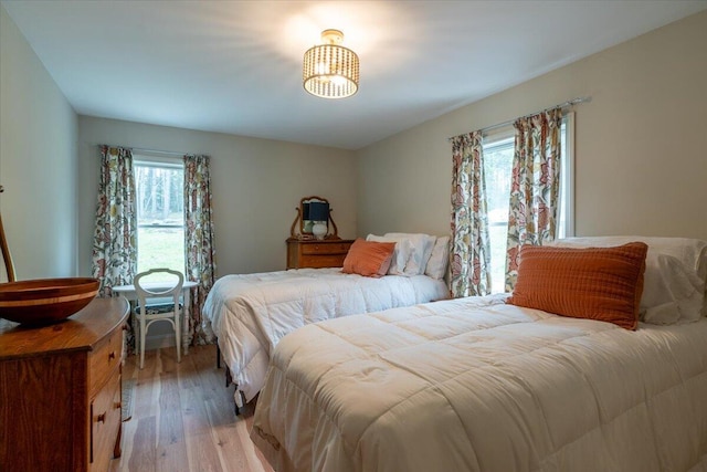 144 Woody Ln, Cushing, ME 04563 - bedroom featuring multiple windows and light wood-style flooring