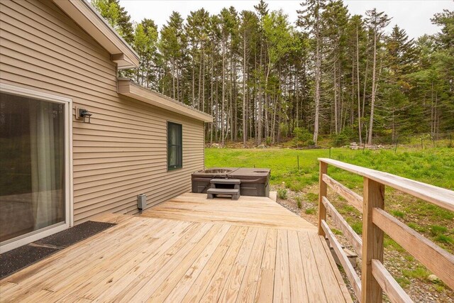 144 Woody Ln, Cushing, ME 04563 - wooden terrace with a fire pit, a view of trees, and a yard