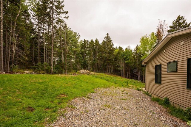 144 Woody Ln, Cushing, ME 04563 - view of green lawn with a forest view