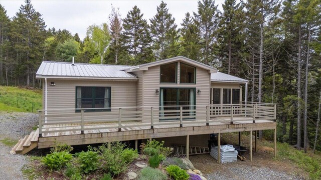 144 Woody Ln, Cushing, ME 04563 - back of property with a wooden deck and metal roof