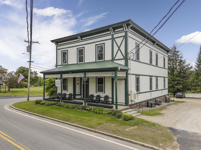 15 Mill Hl Unit 2B, Bethel, ME 04217 - italianate house with covered porch, a front yard, and metal roof