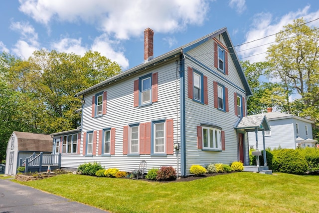 33 Neally St, South Berwick, ME 03908 - view of side of home with a chimney and a lawn