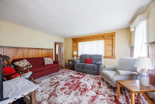 33 Neally St, South Berwick, ME 03908 - living area with wallpapered walls, healthy amount of natural light, and wainscoting